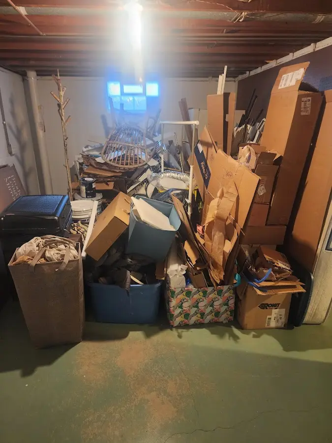 Roll-off dumpster container at job site for 8 Yard Dumpster Rental in Belding